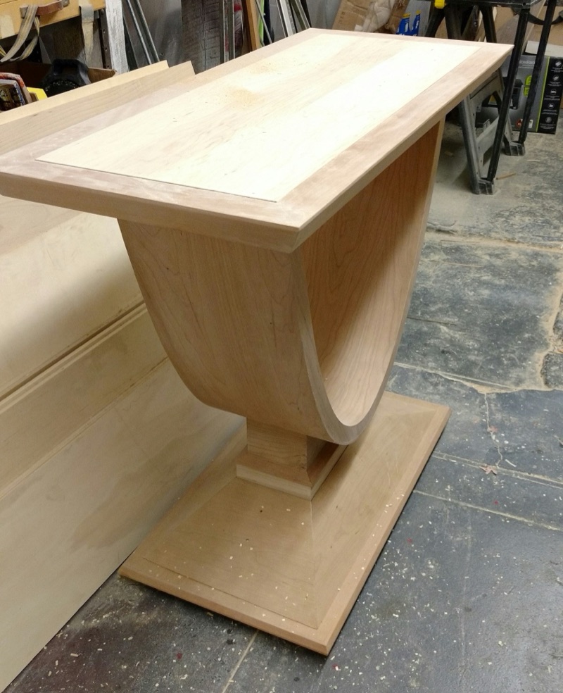 The candlestick-inspired side table hand-shaped in raw oak in the Van Aken Design workshop before finishing